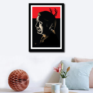 Wall decor of Framed Poster of Hannibal. The image shows the lead actor in his side profile against a predominantly red and black background, with Stag Horns in the background composition.