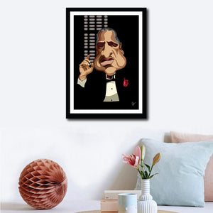 Framed Godfather Poster on a wall decor. Caricature Art by Prasad Bhat showing Don Corleone sitting in his iconic pose with a red pocket rose, his one hand held up and against a black backdrop.