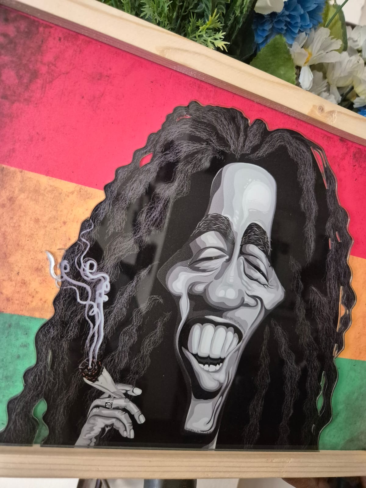Bob Marley acrylic frame home decor piece with vibrant reggae theme