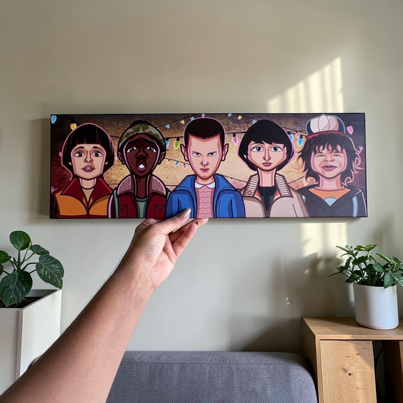 Pop culture wall decor featuring quirky caricature artwork