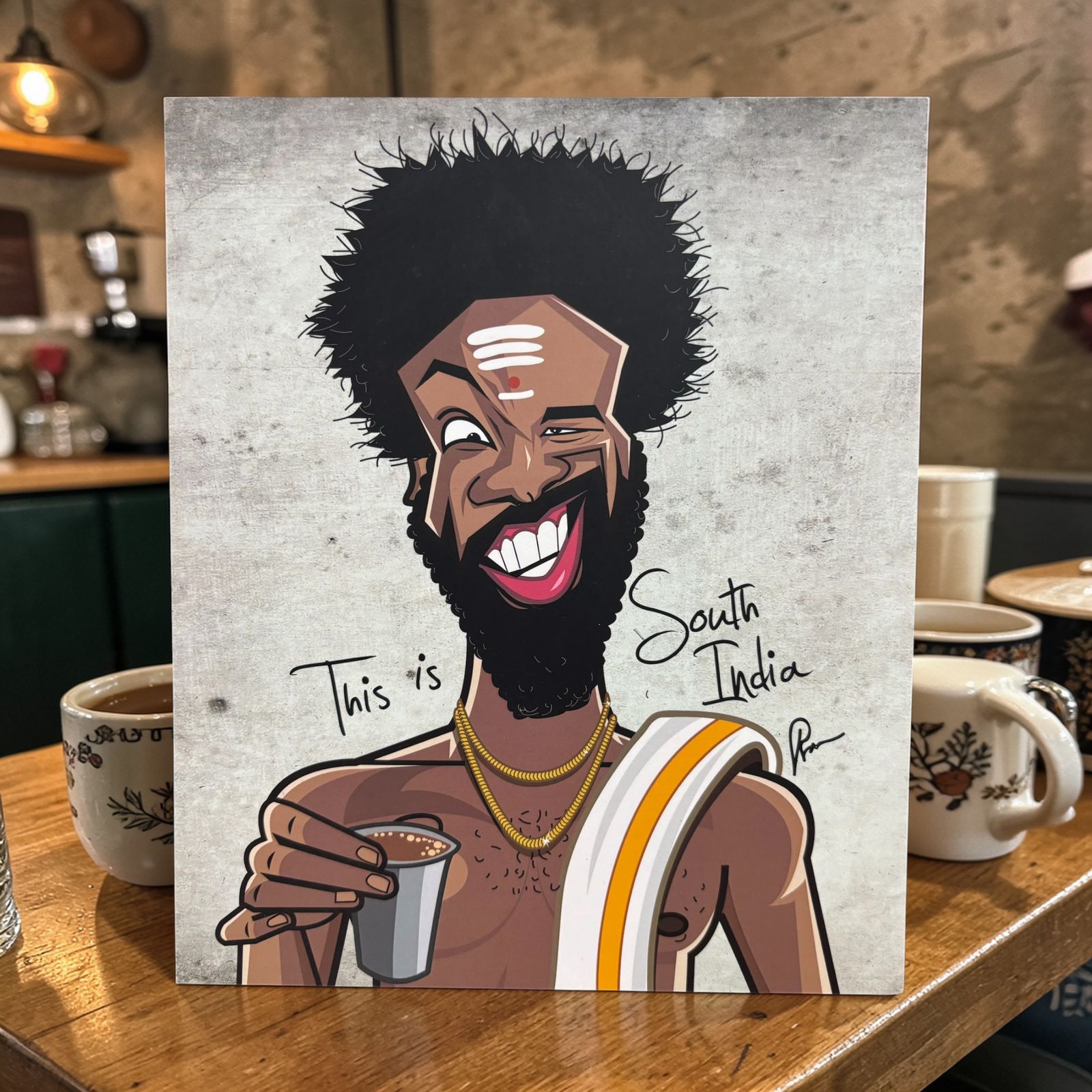 Quirky South India themed wall art with vibrant caricature style design