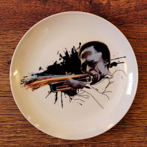 Miles Davis Wall Decor Plate by Prasad Bhat against a wooden panel