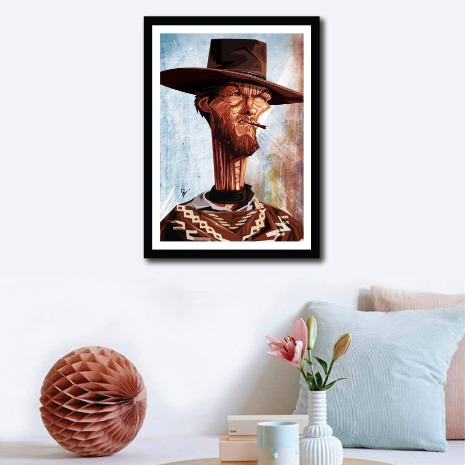 Clint Eastwood Framed Poster on a wall decor by Prasad Bhat. Image shows him in his iconic Cowboy attire looking far ahead with sharp eyes and a cigarette clenched between his teeth.