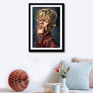 Framed Poster of TV Character Tyrion in caricature tribute art by Prasad Bhat. Image shows wall decor of the artwork, Artwork has him standing sideways and looking to the front. He is in his royal attire and with his golden hair looking grim. 